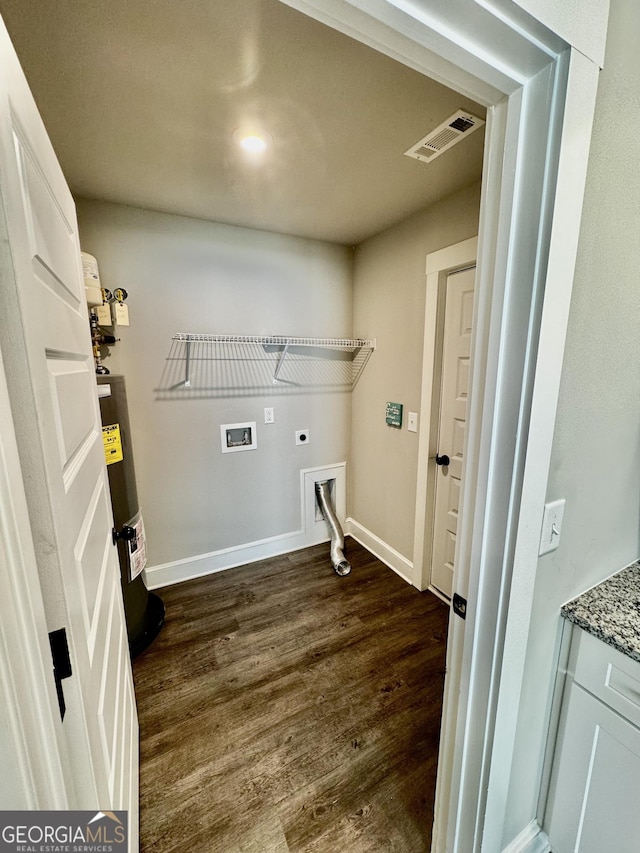 1037 E Doyle St, Toccoa, GA 30577 - washroom with water heater, hookup for an electric dryer, dark wood finished floors, and washer hookup