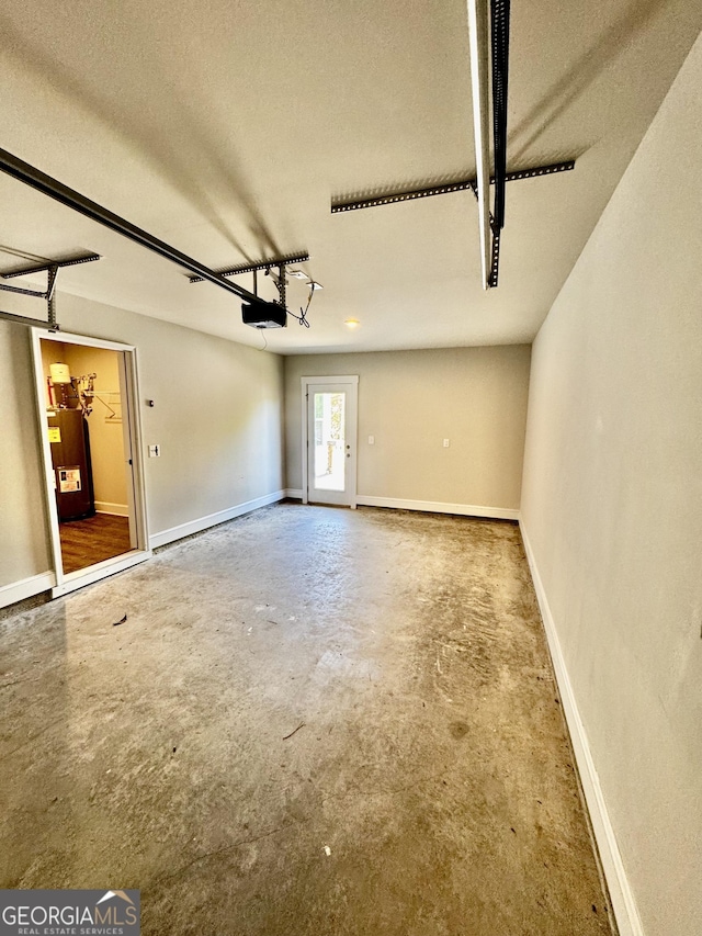 1037 E Doyle St, Toccoa, GA 30577 - garage with electric water heater and a garage door opener