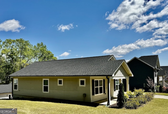 1037 E Doyle St, Toccoa, GA 30577 - view of side of home featuring a lawn, board and batten siding, and a shingled roof