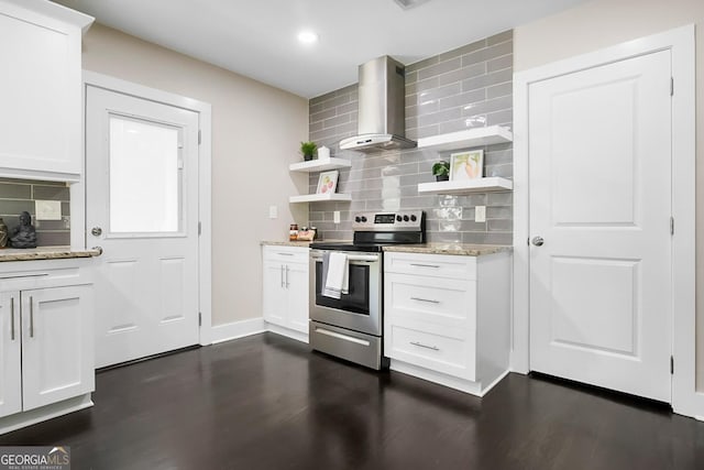 kitchen with wall chimney exhaust hood, light stone countertops, stainless steel electric range oven, open shelves, and decorative backsplash