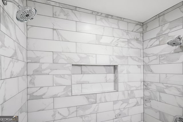 details featuring a tile shower