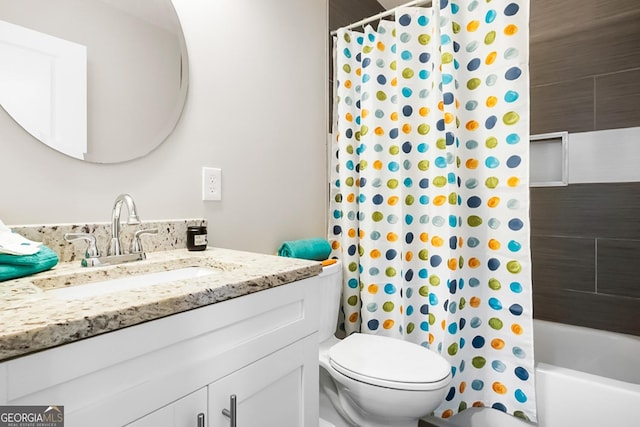 full bath featuring shower / tub combo, vanity, and toilet