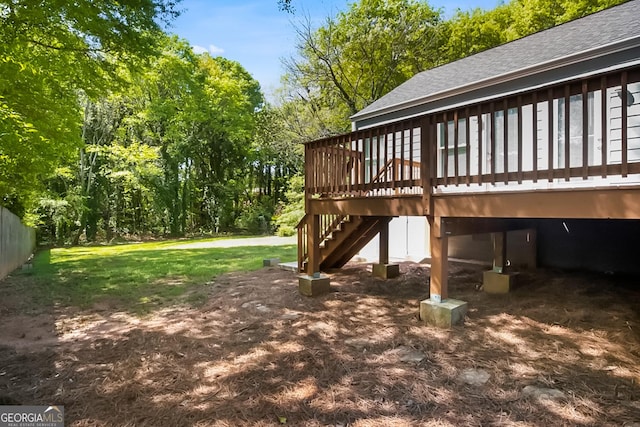 view of yard featuring a deck and stairs