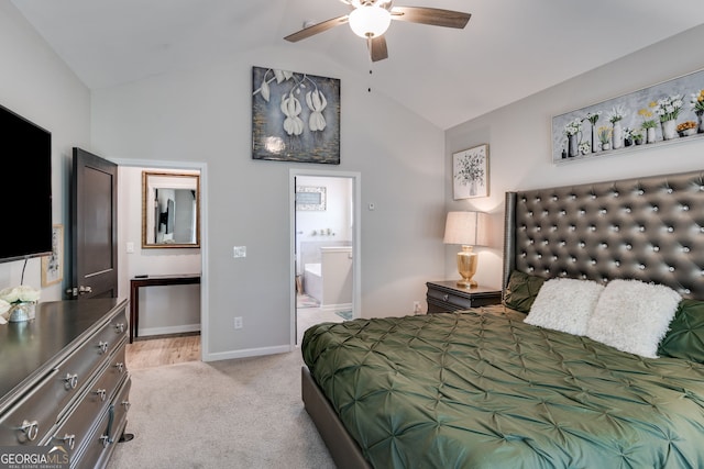 bedroom featuring ensuite bath, baseboards, high vaulted ceiling, and light colored carpet