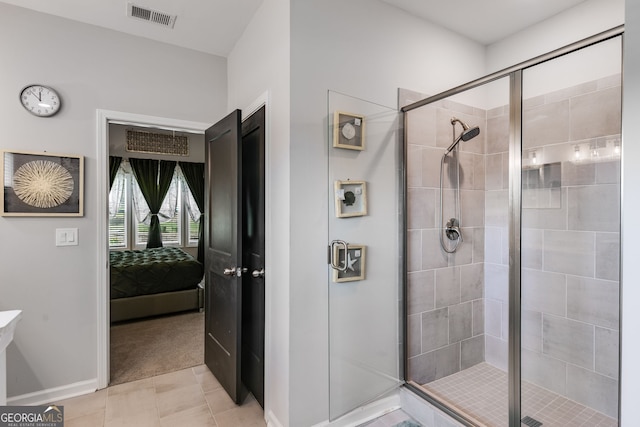 bathroom with baseboards, ensuite bath, visible vents, and a stall shower