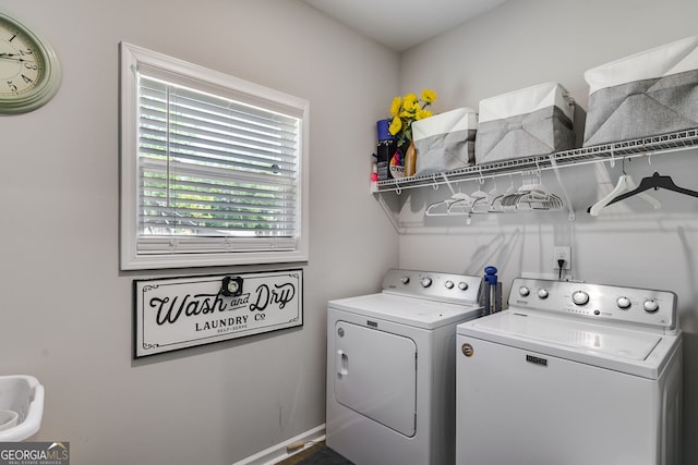 laundry area with washer and clothes dryer and laundry area