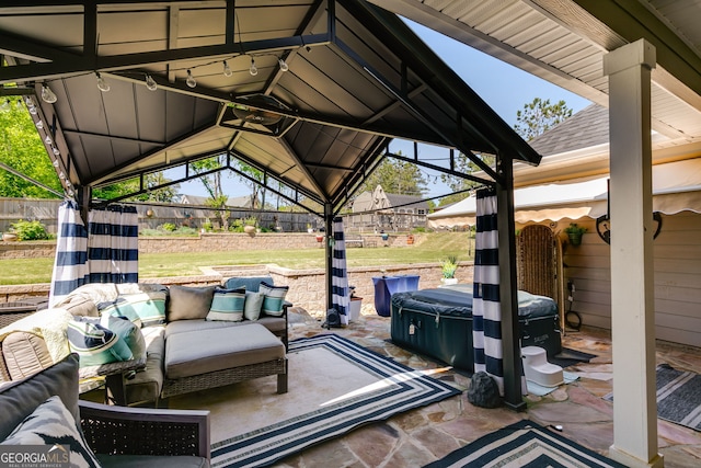 view of patio / terrace featuring fence and an outdoor living space