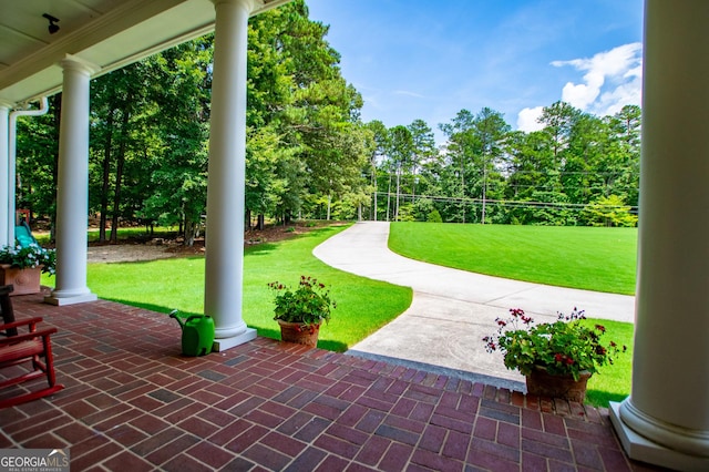 4149 Yancey Rd, Douglasville, GA 30135 - exterior space featuring a patio and a lawn