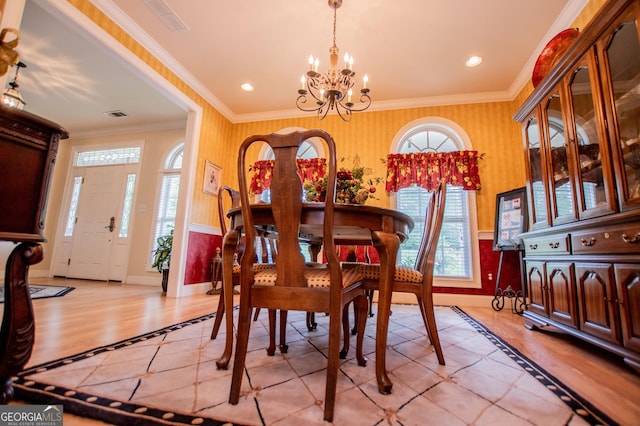 4149 Yancey Rd, Douglasville, GA 30135 - dining area with plenty of natural light, a notable chandelier, and crown molding