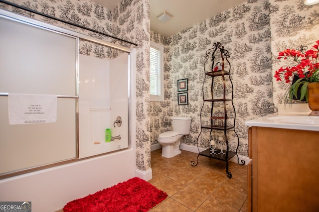 4149 Yancey Rd, Douglasville, GA 30135 - full bathroom featuring baseboards, wallpapered walls, enclosed tub / shower combo, tile patterned floors, and toilet