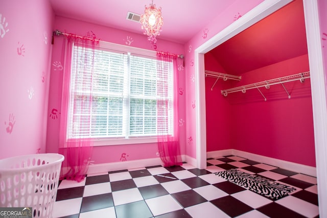 4149 Yancey Rd, Douglasville, GA 30135 - unfurnished bedroom with visible vents, tile patterned floors, a closet, and baseboards