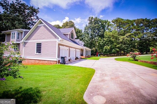 4149 Yancey Rd, Douglasville, GA 30135 - view of property exterior with an attached garage, roof with shingles, driveway, and a lawn