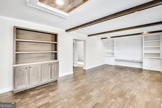 350 Pea Ridge Rd, Ball Ground, GA 30107 - unfurnished living room featuring wood finished floors, built in features, beamed ceiling, baseboards, and ornamental molding