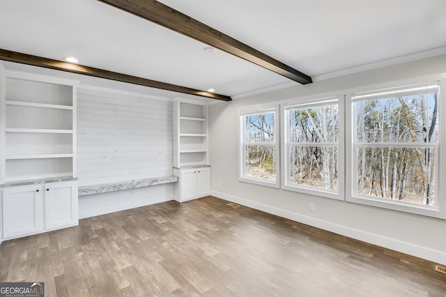 350 Pea Ridge Rd, Ball Ground, GA 30107 - unfurnished living room with beamed ceiling, wood finished floors, baseboards, and ornamental molding