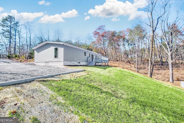 350 Pea Ridge Rd, Ball Ground, GA 30107 - view of property exterior featuring a lawn and a deck