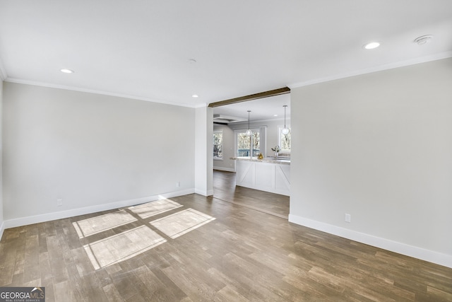 350 Pea Ridge Rd, Ball Ground, GA 30107 - unfurnished living room featuring ornamental molding, baseboards, wood finished floors, and recessed lighting