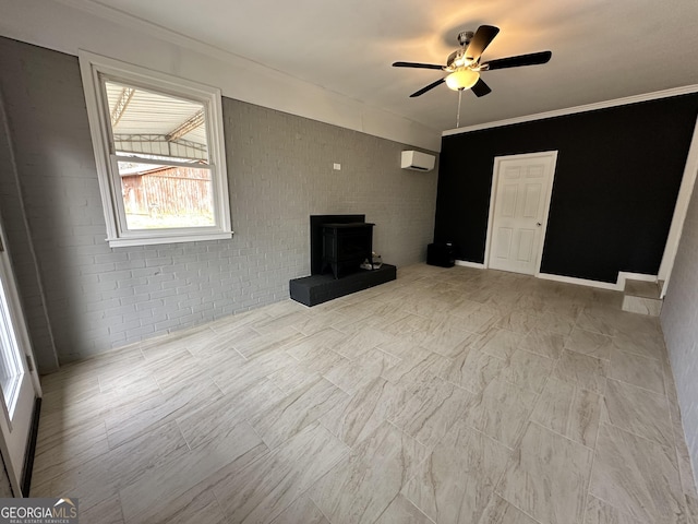 unfurnished living room with a wall mounted AC, ornamental molding, a ceiling fan, and a wood stove