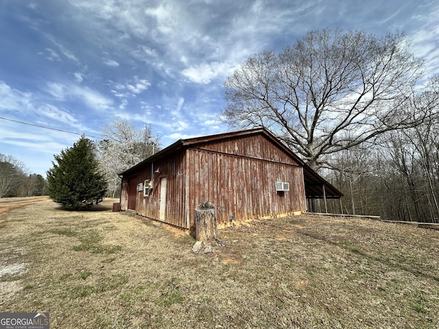 view of side of home with an outbuilding