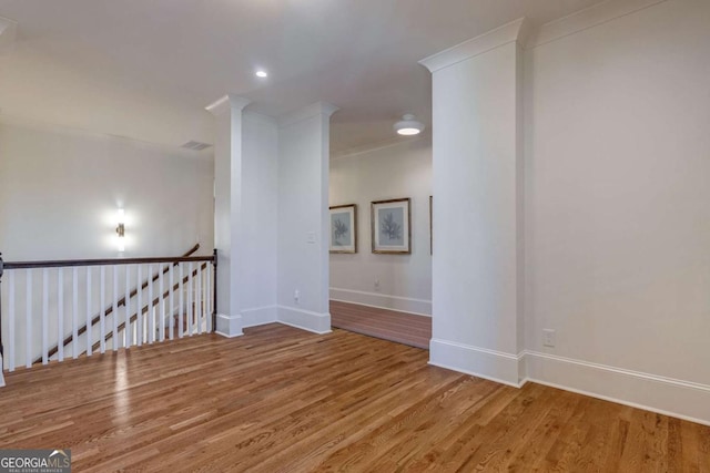 unfurnished room featuring visible vents, baseboards, recessed lighting, and wood finished floors