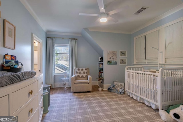 bedroom with baseboards, ornamental molding, a ceiling fan, visible vents, and light colored carpet