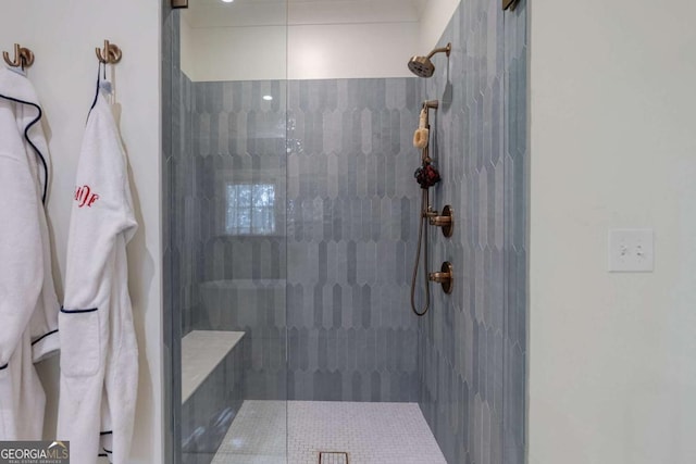 full bathroom with tiled shower