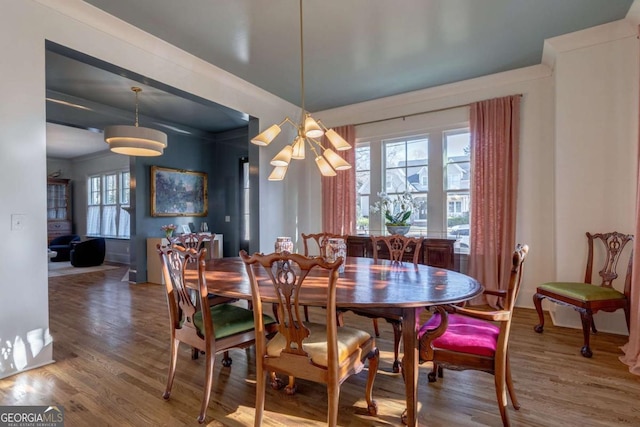 dining area with wood finished floors