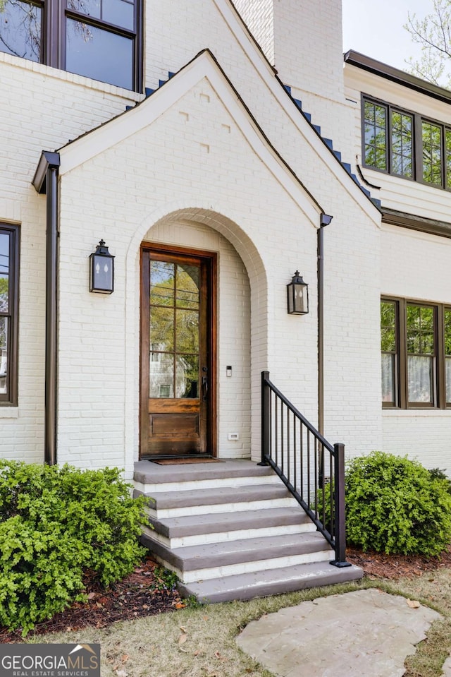 entrance to property with brick siding