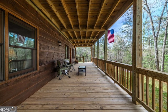 wooden deck featuring a ceiling fan