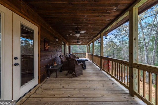 bedroom with wood ceiling, wood-type flooring, wood walls, and multiple windows