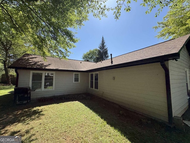 5516 Westberry Ln, Norcross, GA 30071 - back of house featuring a lawn and a shingled roof