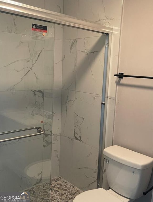 5516 Westberry Ln, Norcross, GA 30071 - bathroom featuring toilet and a stall shower