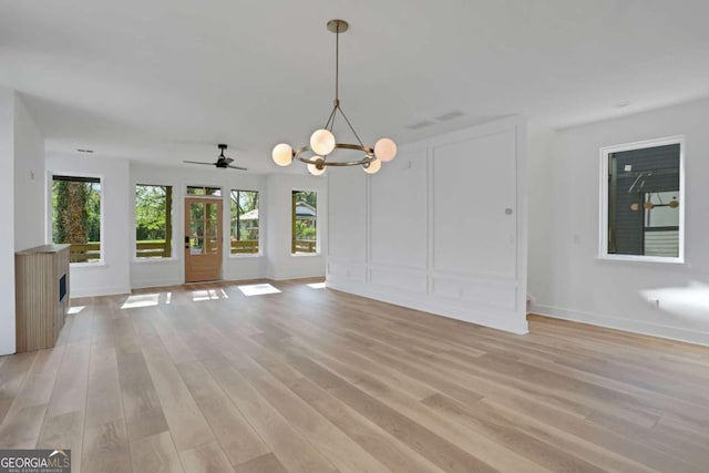 644 Glendale Rd, Scottdale, GA 30079 - unfurnished dining area with baseboards, a chandelier, and light wood-style floors