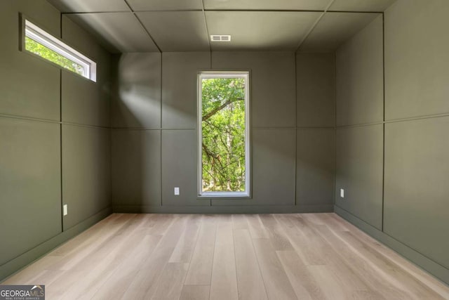 644 Glendale Rd, Scottdale, GA 30079 - bonus room featuring a decorative wall, visible vents, and light wood-type flooring