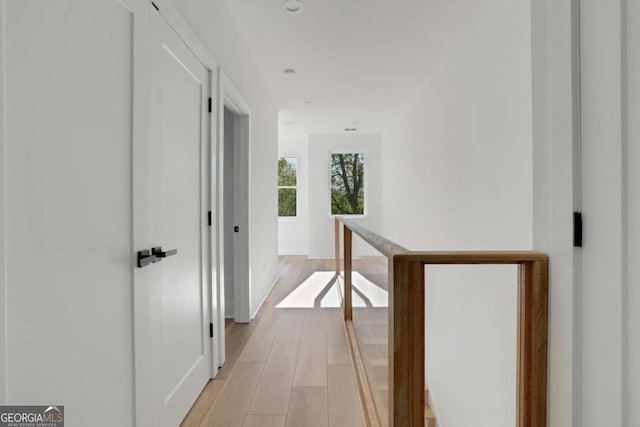644 Glendale Rd, Scottdale, GA 30079 - corridor with light wood-style floors, baseboards, and an upstairs landing