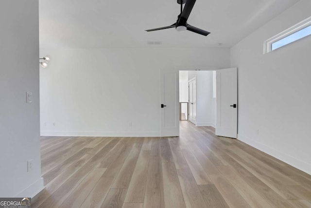 644 Glendale Rd, Scottdale, GA 30079 - unfurnished room with light wood-type flooring, ceiling fan, baseboards, and visible vents