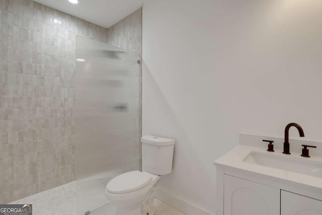 644 Glendale Rd, Scottdale, GA 30079 - full bathroom with vanity, baseboards, tile patterned floors, toilet, and a walk in shower