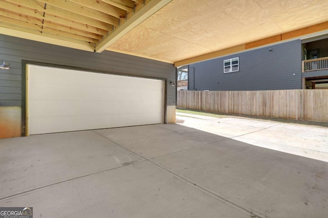 644 Glendale Rd, Scottdale, GA 30079 - garage featuring concrete driveway and fence