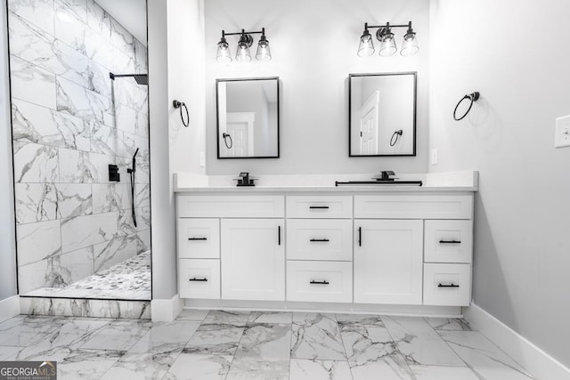 full bath with baseboards, double vanity, a marble finish shower, marble finish floor, and a sink