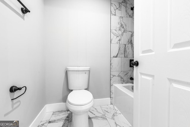 full bath featuring toilet, baseboards, marble finish floor, and shower / bath combination