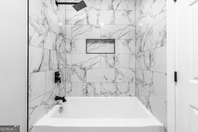 bathroom with bathing tub / shower combination