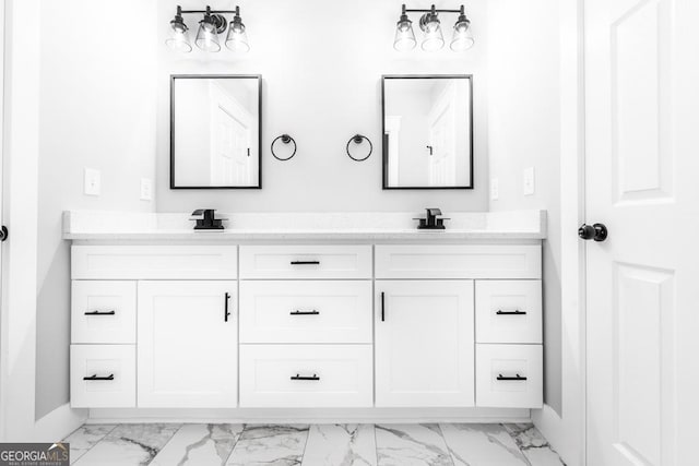 full bathroom featuring double vanity, marble finish floor, and baseboards