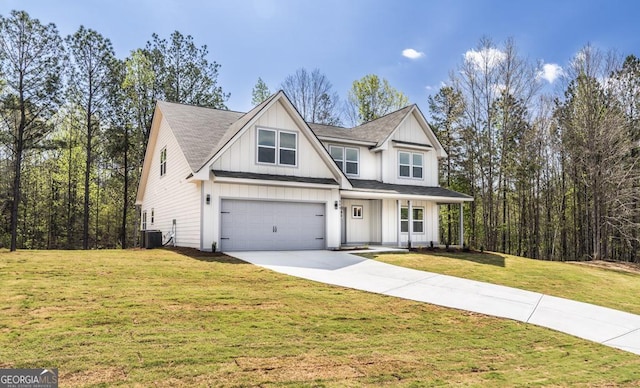 view of front of property with concrete driveway, cooling unit, board and batten siding, a front lawn, and an attached garage
