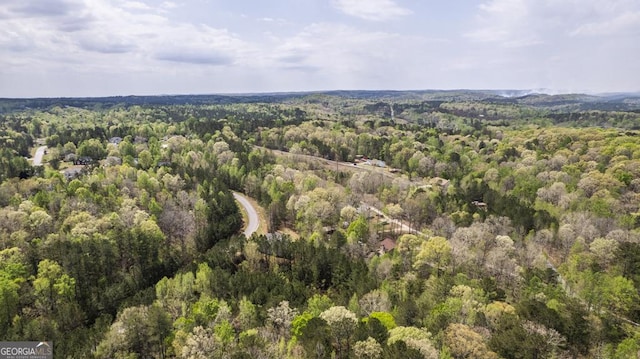 drone / aerial view featuring a view of trees