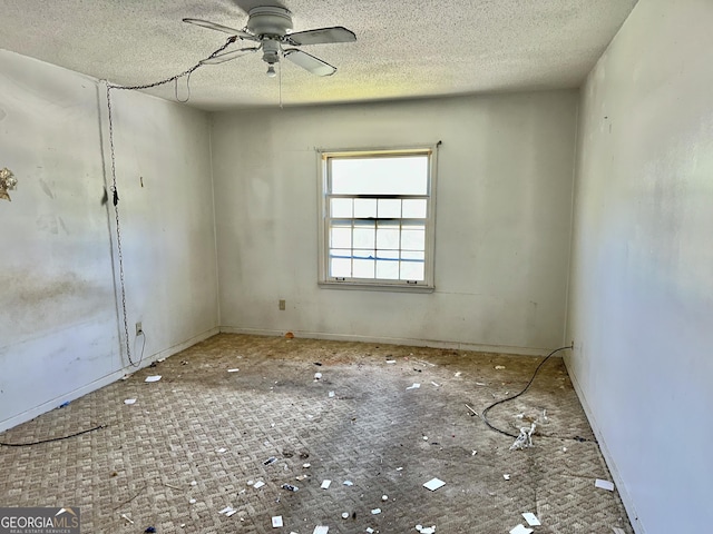 3038 Parc Lorraine, Lithonia, GA 30038 - empty room featuring a textured ceiling, baseboards, and a ceiling fan