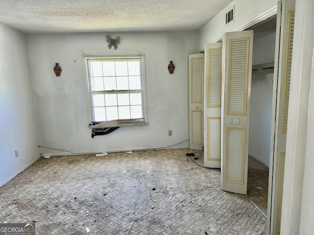 3038 Parc Lorraine, Lithonia, GA 30038 - unfurnished bedroom with visible vents, a textured ceiling, and baseboards