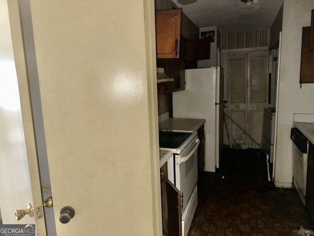3038 Parc Lorraine, Lithonia, GA 30038 - kitchen featuring electric range, brown cabinets, light countertops, and dishwashing machine