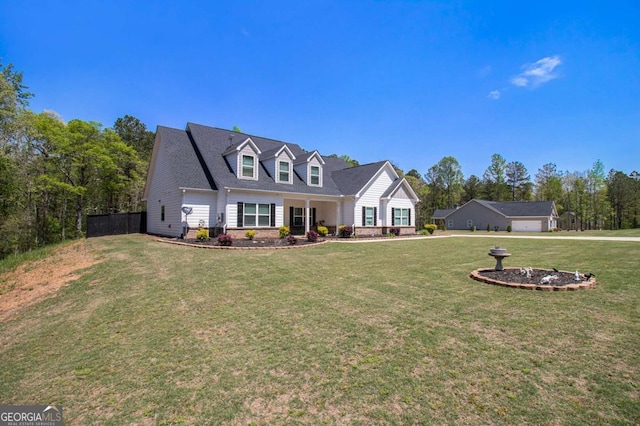 new england style home with a front yard and fence