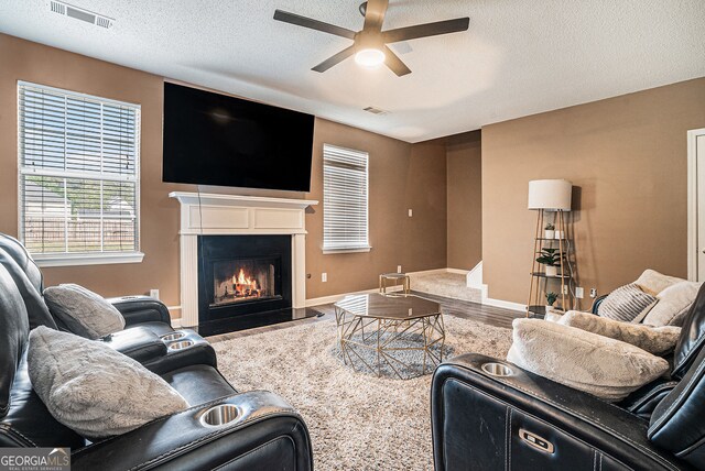 4180 W Stubbs Rd, College Park, GA 30349 - kitchen with appliances with stainless steel finishes, a textured ceiling, light wood-style flooring, baseboards, and visible vents
