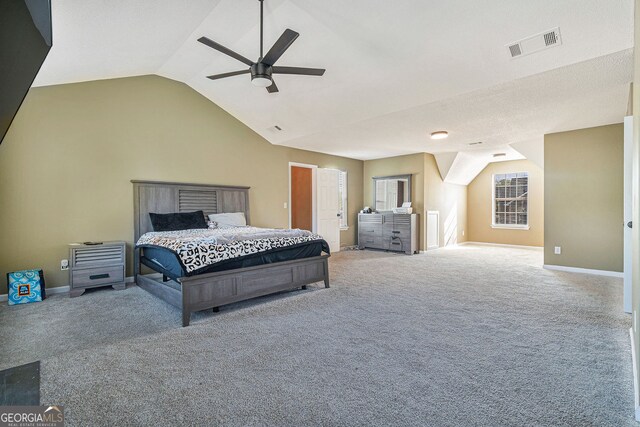 4180 W Stubbs Rd, College Park, GA 30349 - carpeted bedroom featuring baseboards, a fireplace with flush hearth, a textured ceiling, and lofted ceiling