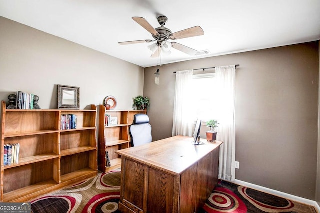 office with ceiling fan, baseboards, and visible vents